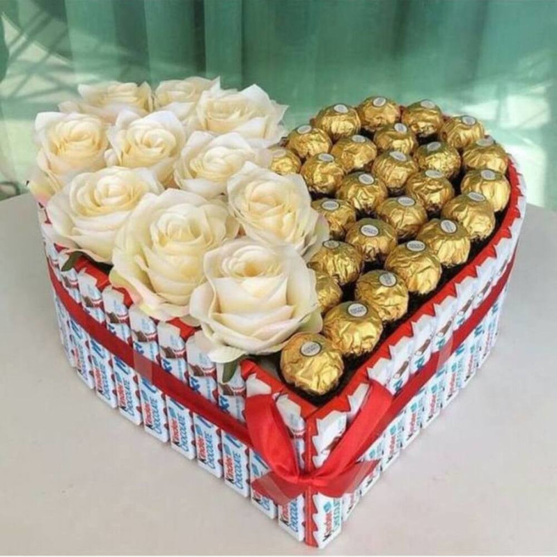 Bouquet of white roses with sweets and chocolate on March 8, standart