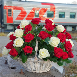 Basket of white and red roses
