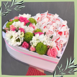 Roses and chrysanthemums in a candy box