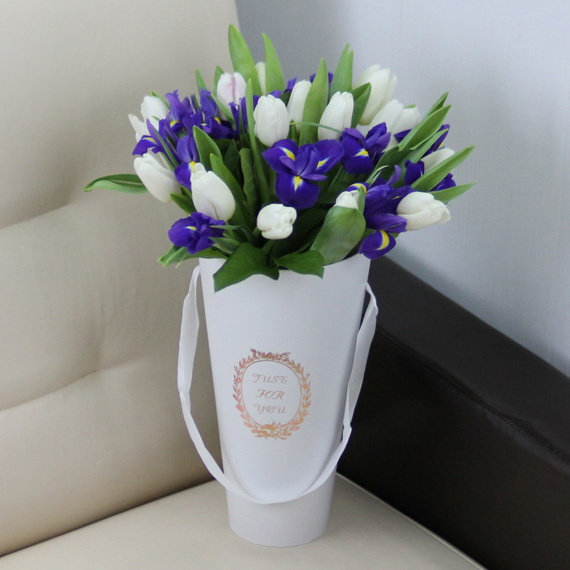White tulips and blue irises in a cone, standart