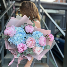 Bouquet of blue hydrangeas and fragrant peonies
