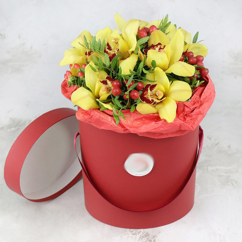 Composition of orchids and hypericum in a hatbox, standart