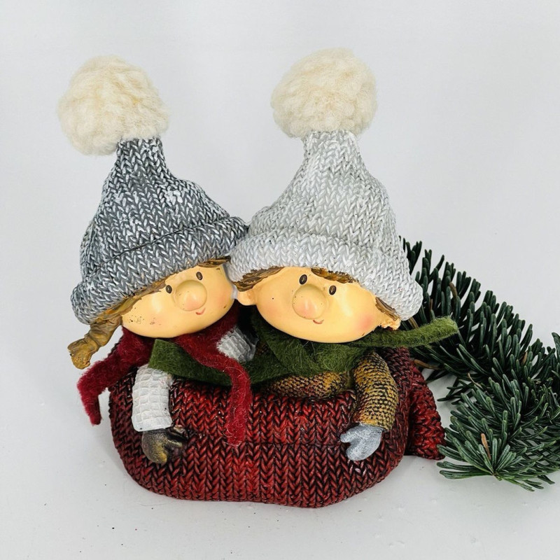 Souvenir boy and girl in knitted hats, standart