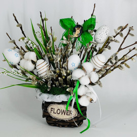 Easter bouquet of natural willow in a wicker flower pot