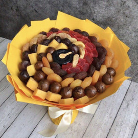 Bouquet of nuts and dried fruits with honey