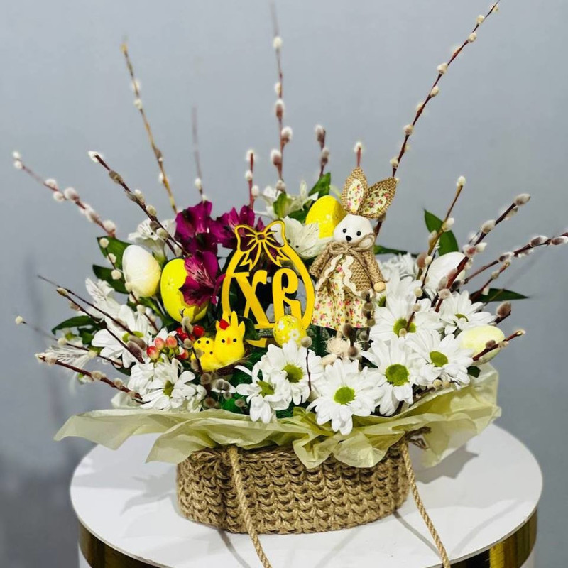 Easter composition on the table - willow bouquet with daisies, standart