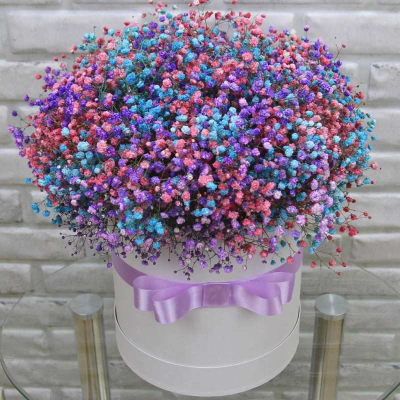 Composition in a hatbox made of multi-colored Gypsophila, standart
