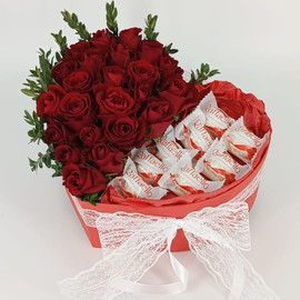 Bouquet of roses in a box with sweets