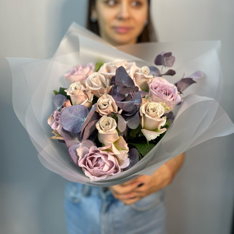 Bouquet of elite roses in a fashionable lavender shade with eucalyptus, standart