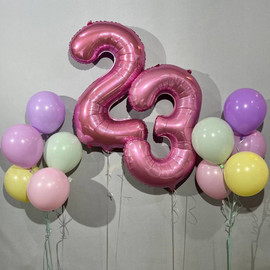 A set of macaroni color balloons with numbers for a girl