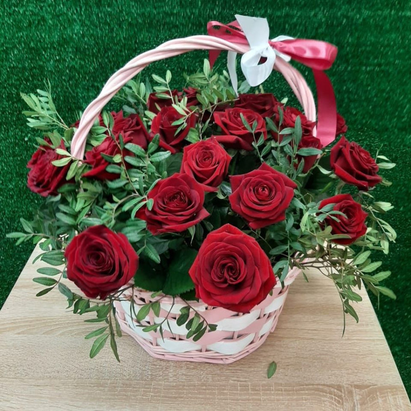 Basket of red roses in greenery, standart