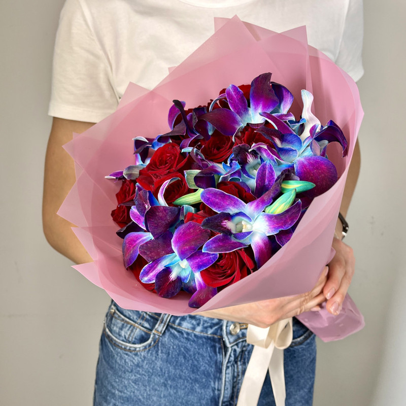 Bouquet of natural flowers from space orchids and burgundy roses, standart
