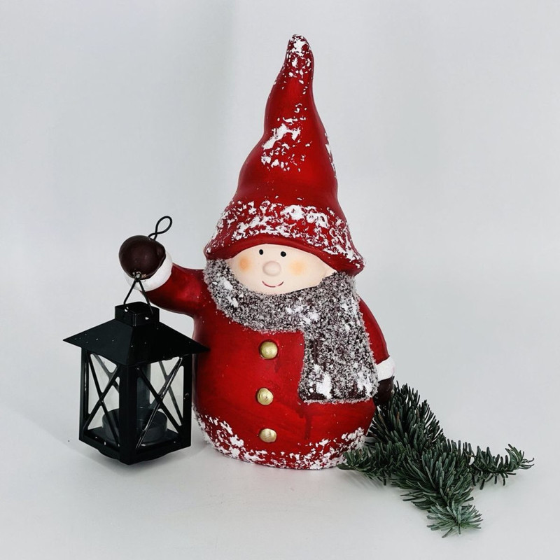 New Year's souvenir candlestick baby in a red outfit with a lantern, standart