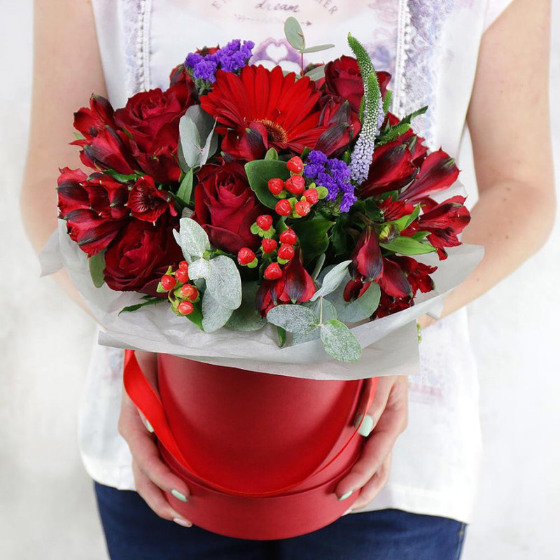 Composition of roses, alstroemerias and gerberas in a hat box, standart