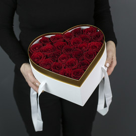 25 red roses in a white heart-shaped box