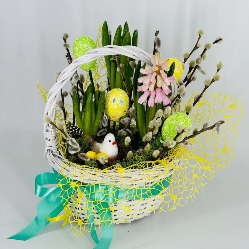 Easter basket with primroses and natural willow branches, standart