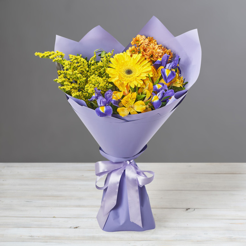 Bouquet of bright yellow gerberas, irises and alstroemerias, standart