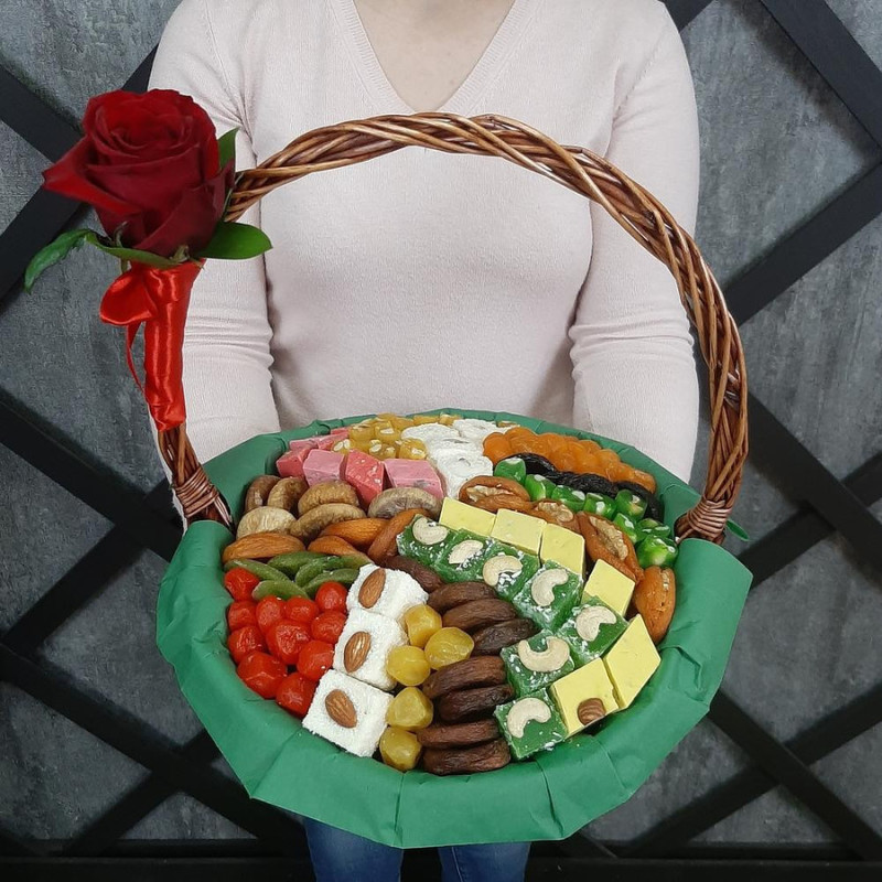 Dried fruits and sweets in a basket, standart