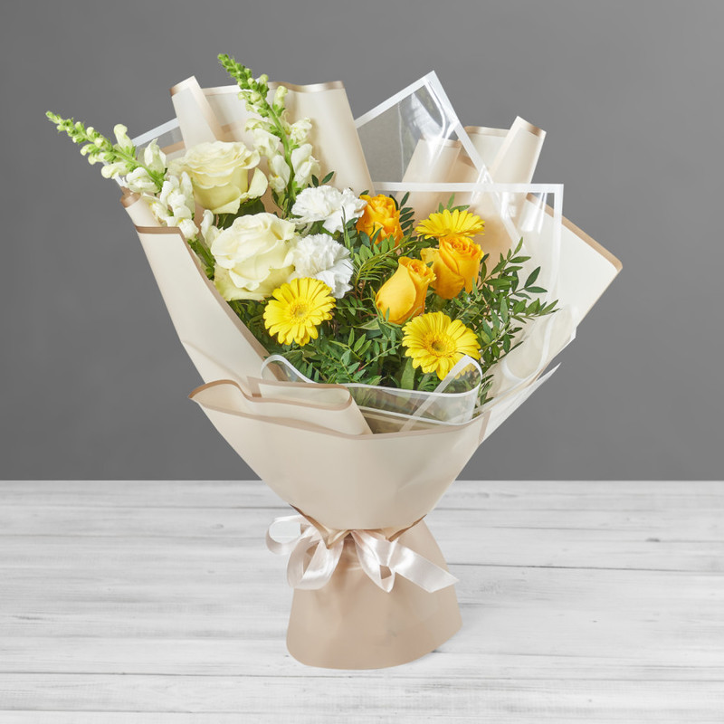 Bouquet of yellow gerberas, antirrinums and delicate roses, standart