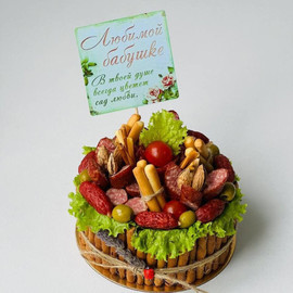 Gift for grandmother cake from snacks and sausages