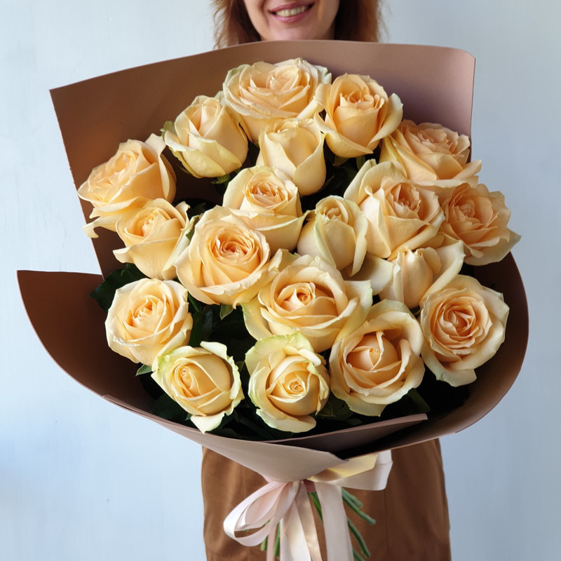 Bouquet of peach roses in a modern package, standart