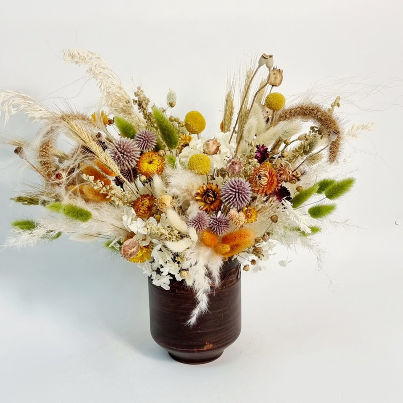 Delicate bouquet of dried flowers in pink tones, standart