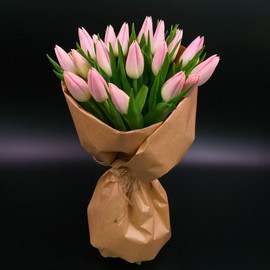Bouquet of pink tulips in craft