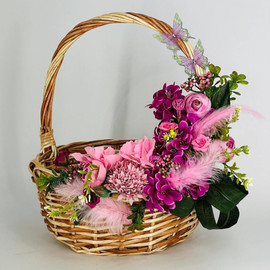 Easter basket with artificial flowers
