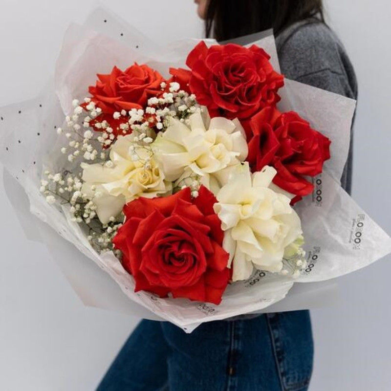 Bouquet of flowers of scarlet roses and white French roses and white gypsophila, standart