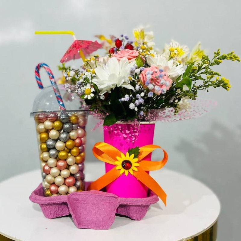 Mini bouquet of flowers in a glass with sweet nuts, standart