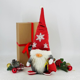 Interior handmade toy gnome Santa Claus with a bag
