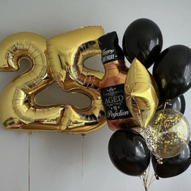 Anniversary balloons with foil numbers and bottle figure