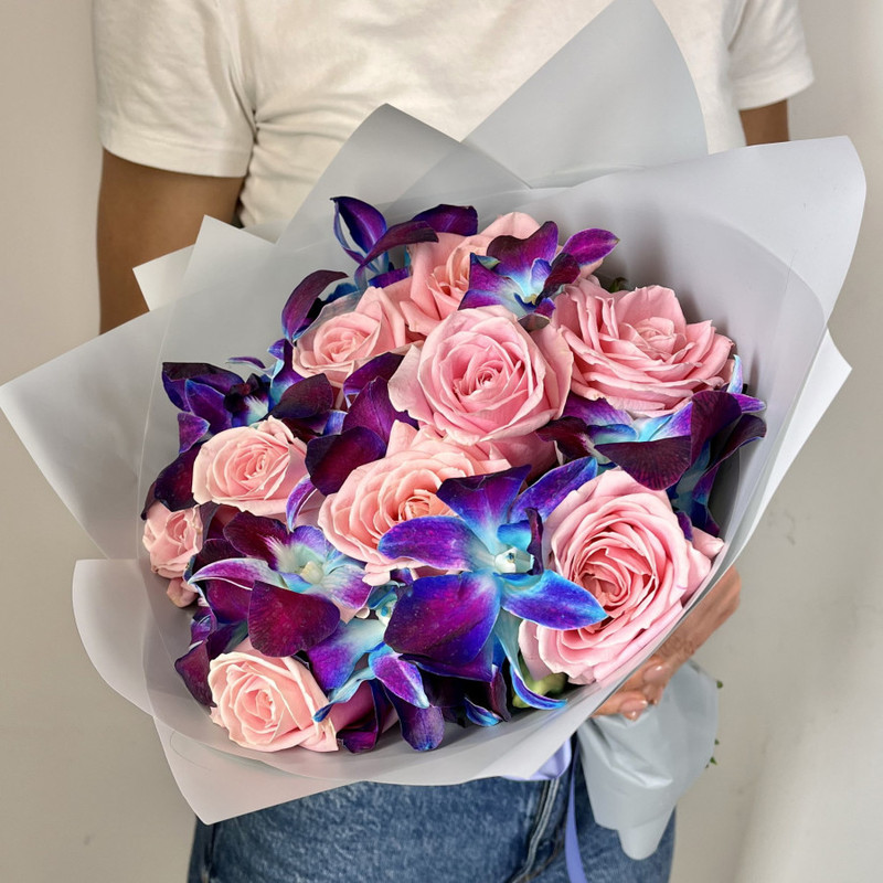 Bouquet of fresh flowers from space orchids and pink roses, standart