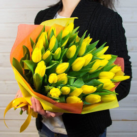51 yellow tulips in designer packaging