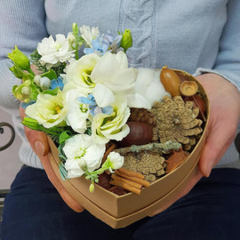 Winter composition in the heart of freesia, matthiola and natural gifts