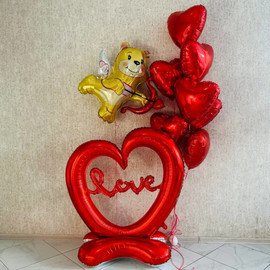 Photo zone made of balloons for February 14, a huge floor heart with Cupid the bear