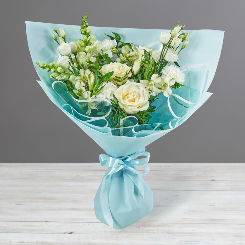 Bouquet of roses, eustomas and antirrinums in delicate colors, standart