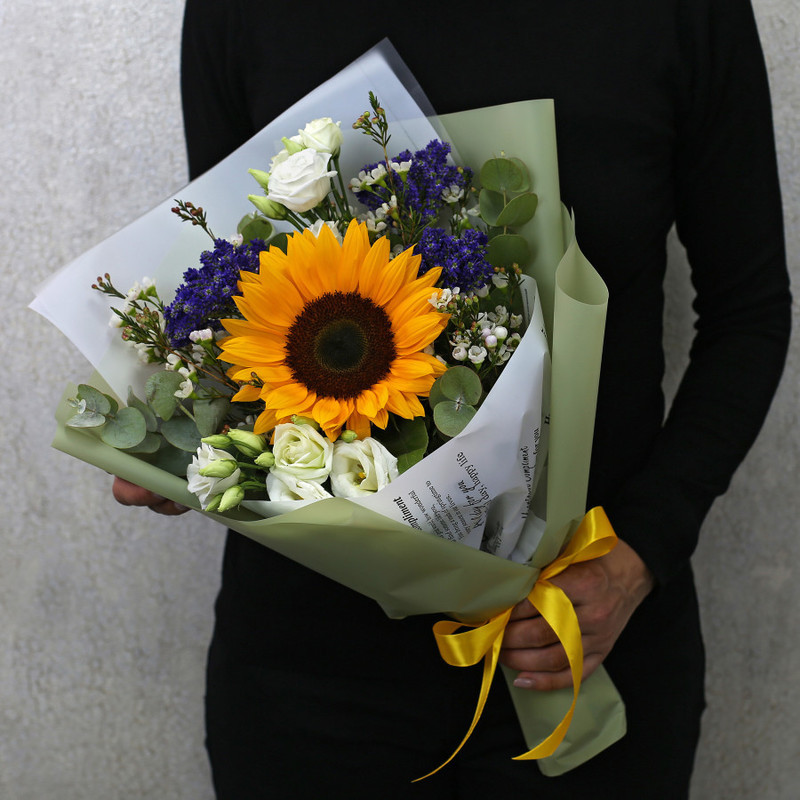 Bouquet of sunflower, white eustoma and blue veronica in designer packaging, standart