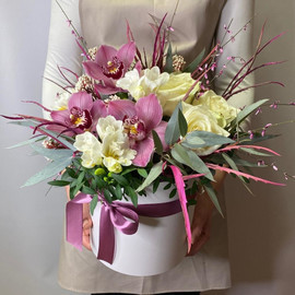 Box with orchids and freesias