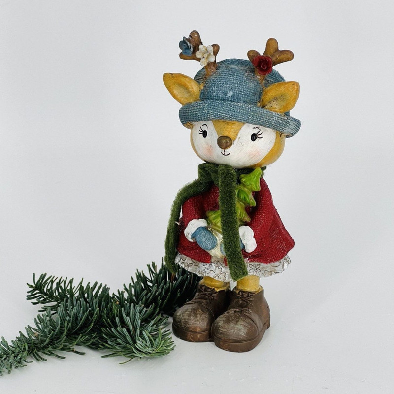 New Year's souvenir deer in a blue hat with a Christmas tree, standart