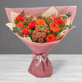 Bright bouquet of red gerberas, roses and alstroemerias