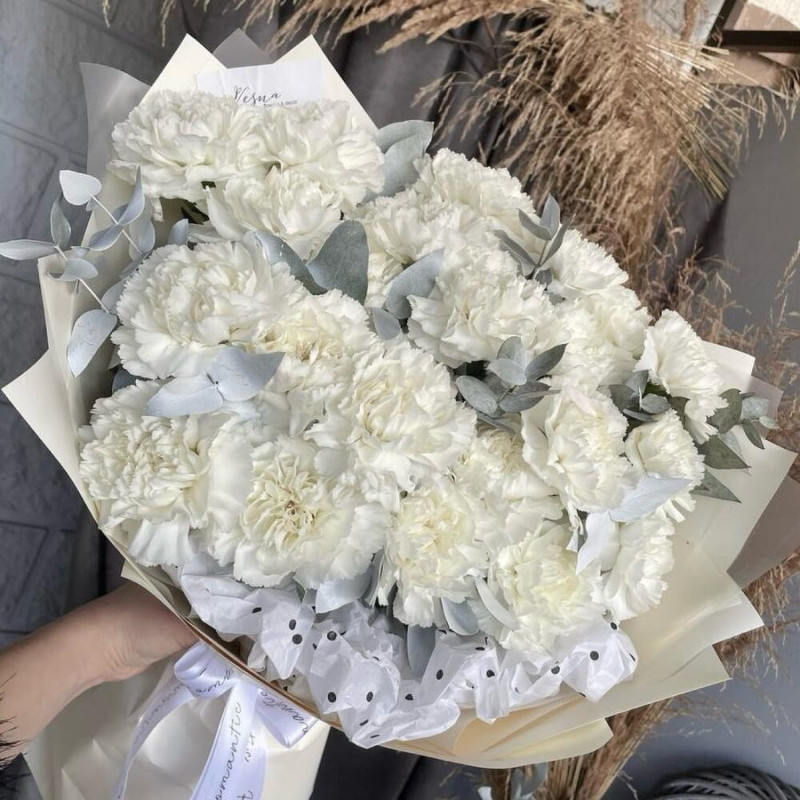 Delicate bouquet of white dianthus with eucalyptus sprigs, standart