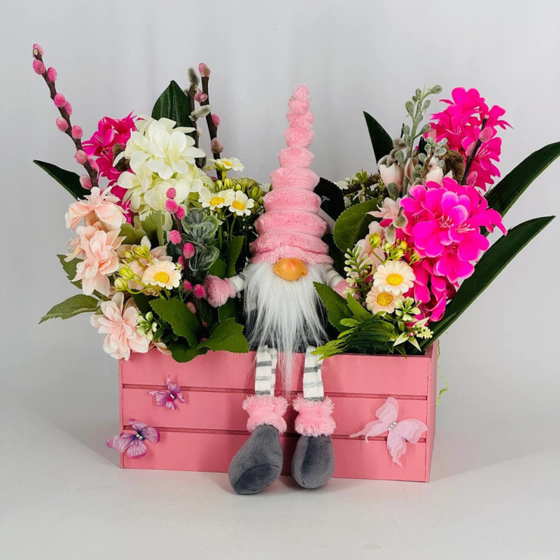 Composition of artificial flowers with willow branches and an interior gnome doll, standart