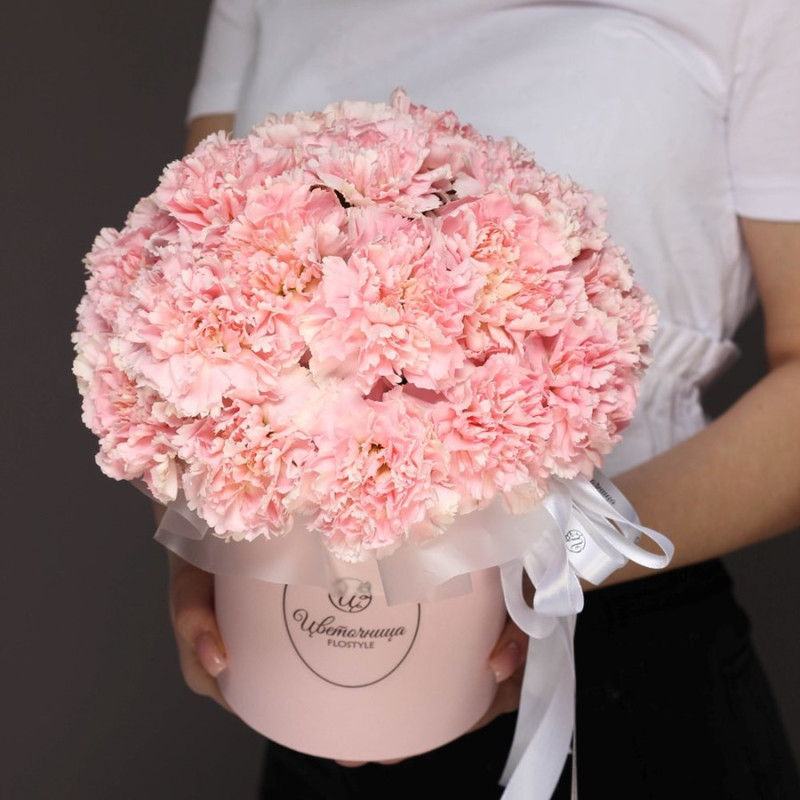 Flowers in a hat box. Dianthus pink carnation Cosmo, standart