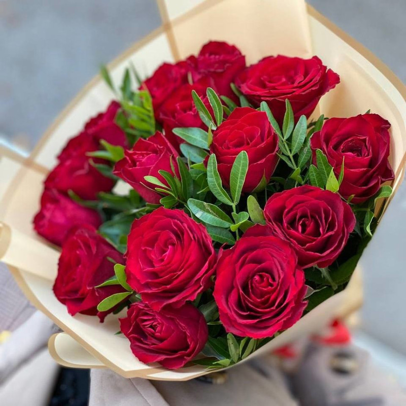 Bouquet of scarlet roses and fresh greenery, standart