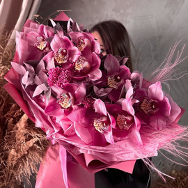 Author's bouquet with orchids, ozothamnus and eucalyptus sprigs