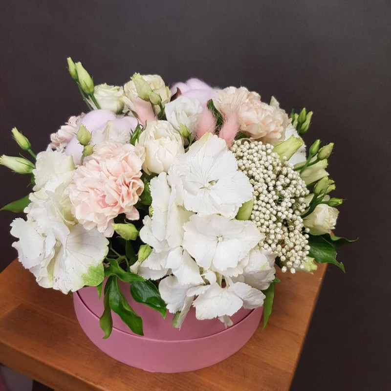 Flowers in a pink box. With white hydrangea, pink cotton and peach dianthus, standart