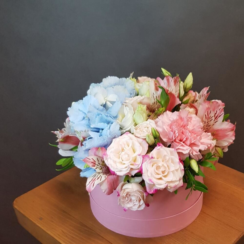 Flowers in a pink box. MINI with blue hydrangea and pink spray rose, standart