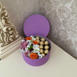 Roses and chrysanthemums in a candy box