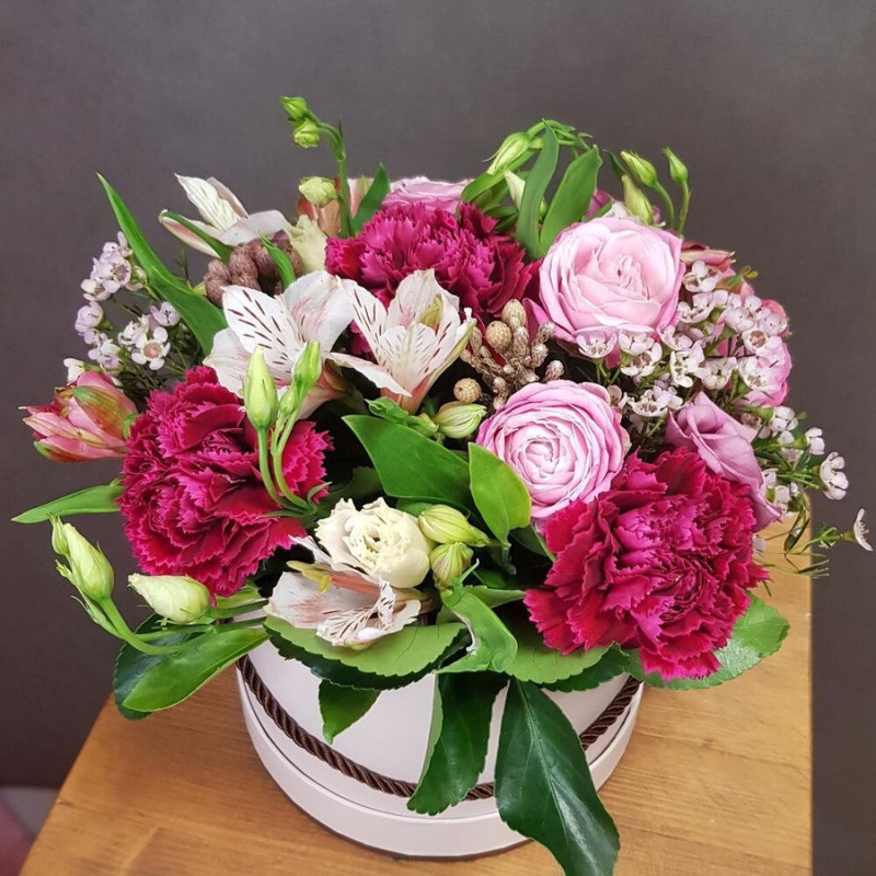 Flowers in a box. Raspberry fresh with raspberry dianthus and peony rose, standart